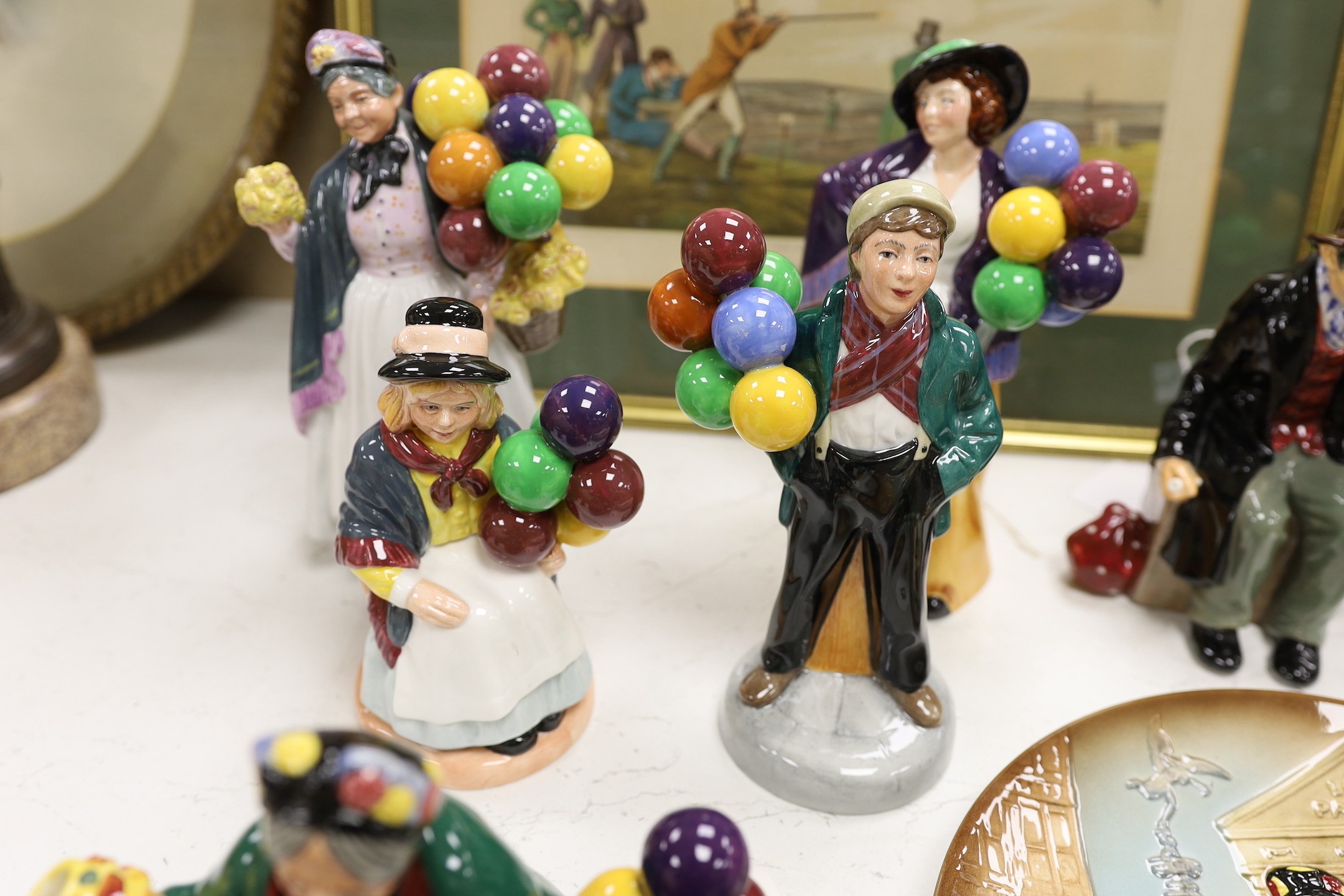 Seven Royal Doulton balloon seller figures in various sizes, a similar teapot and a dish (9), tallest Biddy Penny Farthing, 22cms high